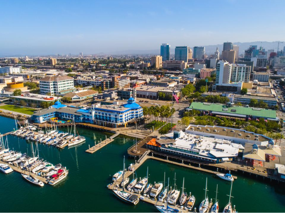 Aerial view of Jack London Square including harbor with boats.
